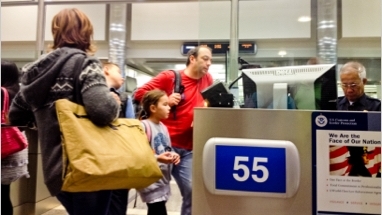 people getting inspected at an airport