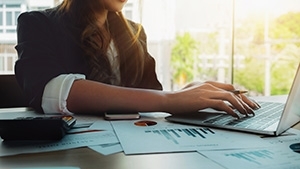 photo of a woman using a computer